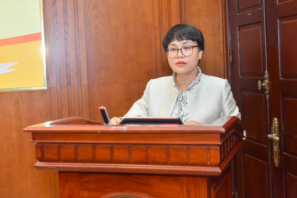 Vụ trưởng Vụ Tài chính – Kế toán Nguyễn Hồng Vân báo cáo tại Hội nghị